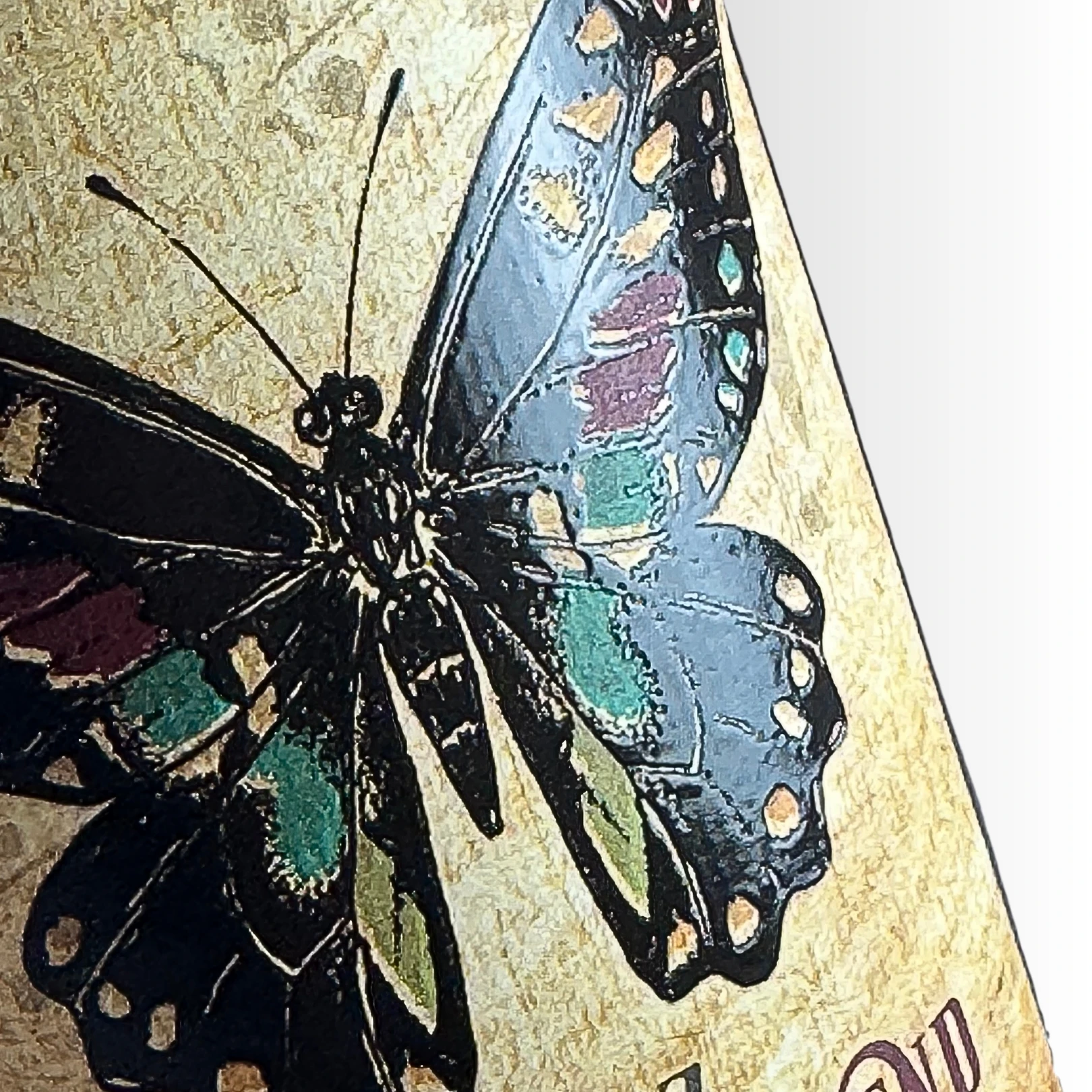 Wine label featuring an illustrated butterfly with high build print finishes